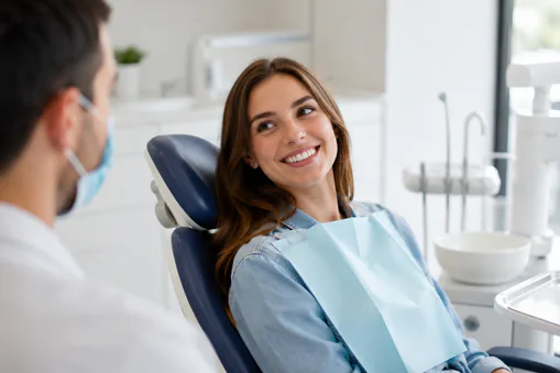 Young woman at dentist receiving dental exam
